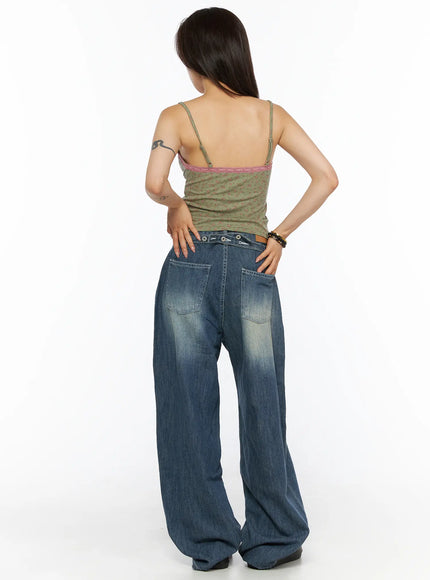 Jesse Vintage Wash Wide Leg Jeans CU530 Blue full back view on model in floral cami, hands on hips, oversized wide leg with vintage faded wash