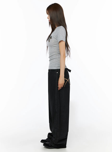 Kairo Back Buckle Wide Jeans IL515 Black full-length side view on model in gray tee showing exaggerated wide-leg silhouette and tan X-stitch side pocket detail