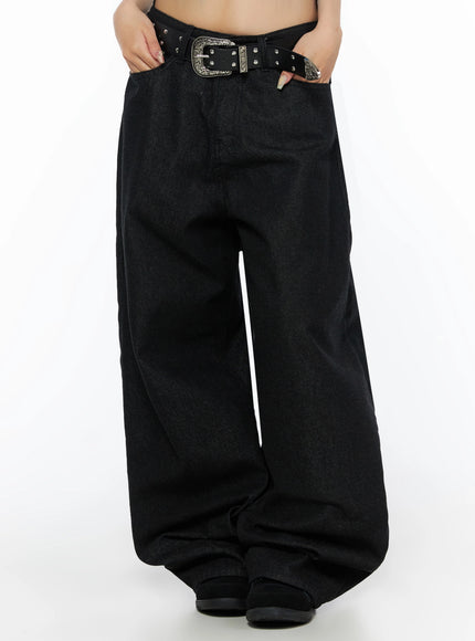 Kairo Back Buckle Wide Jeans IL515 Black cropped front view on model showing wide-leg denim silhouette with studded western belt and model hand in pocket pose