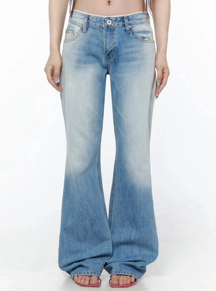 LEWKIN Keilani Low-Rise Bootcut Jeans IL502 Blue front crop shot on model showing low-rise waistband, button fly, faded wash flare leg, size S