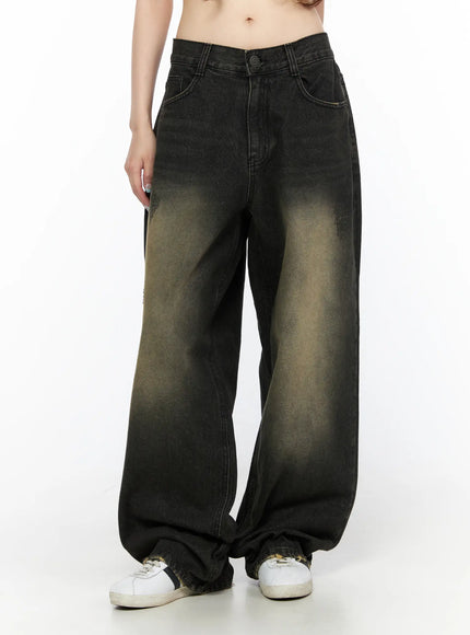 Keisha Washed Baggy Jeans CL523 Black front view on model, cropped waist shot highlighting prominent yellow-khaki center fade and wide-leg pooled hem