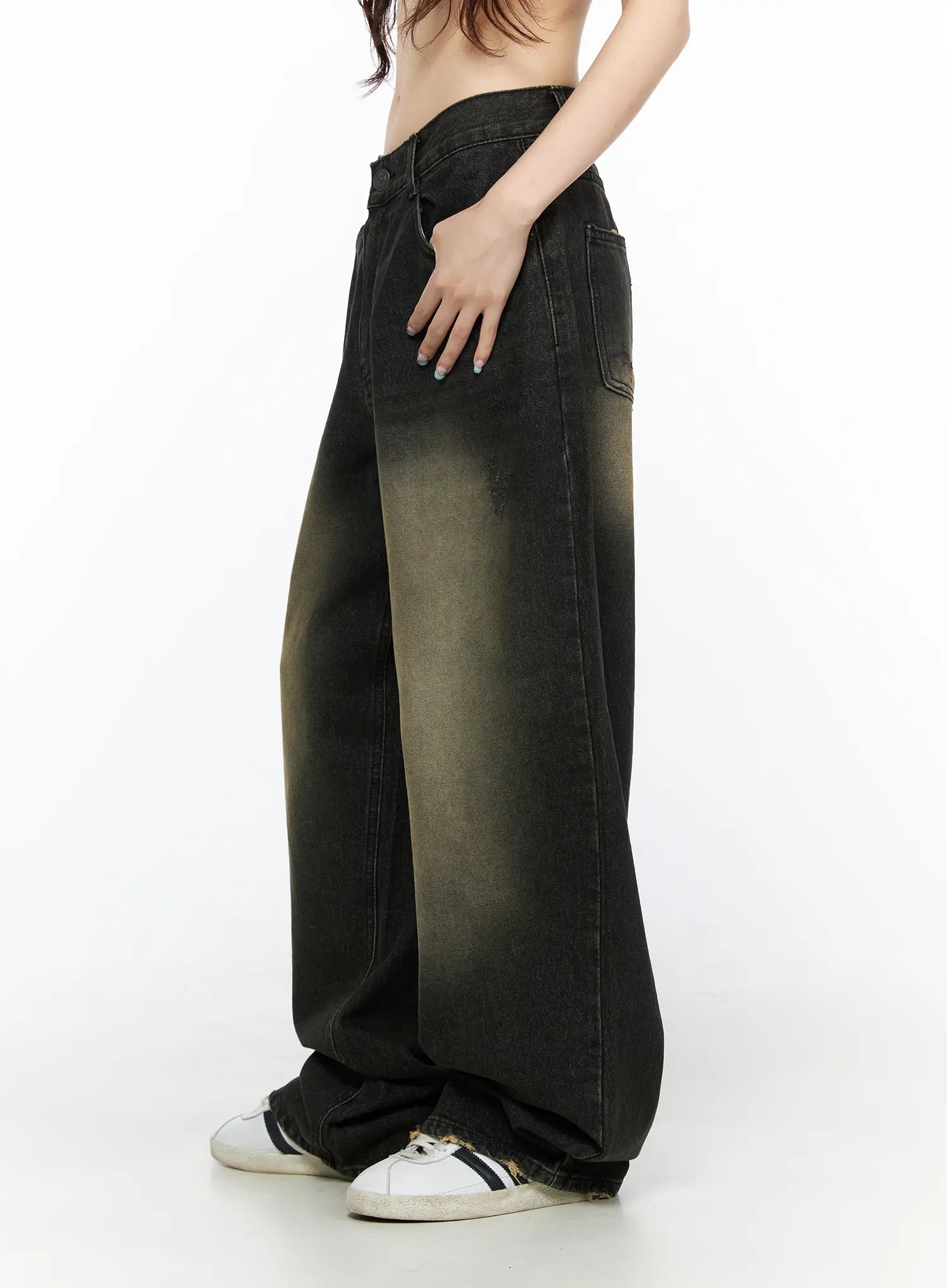 Keisha Washed Baggy Jeans CL523 Black side view on model, cropped waist shot showing wide-leg drape and yellow-khaki gradient wash detail