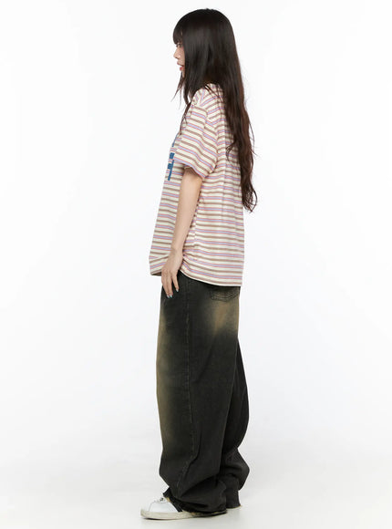 Keisha Washed Baggy Jeans CL523 Black full-body side view on model, showing ultra wide-leg pooling at hem, paired with striped oversized tee