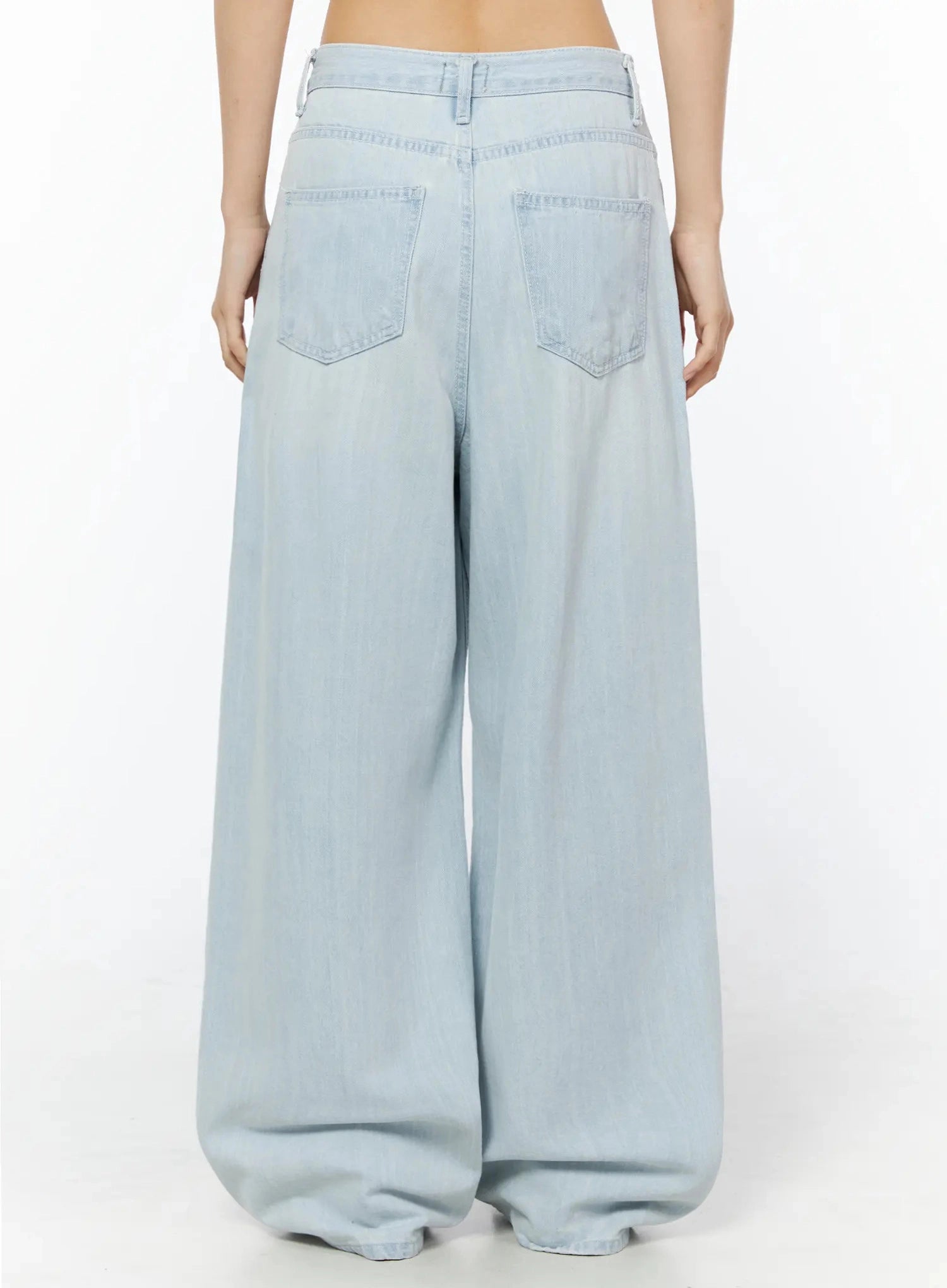 Keliana Soft Wide-Leg Jeans IL516 Light blue back full-length on model showing two back patch pockets, belt loops, and wide flared hem
