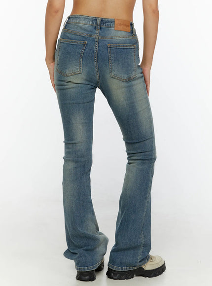 Kendall Vintage Bootcut Jeans CL515 Blue back view on model showing dual back pockets leather ozbridge label and flared hem with fading