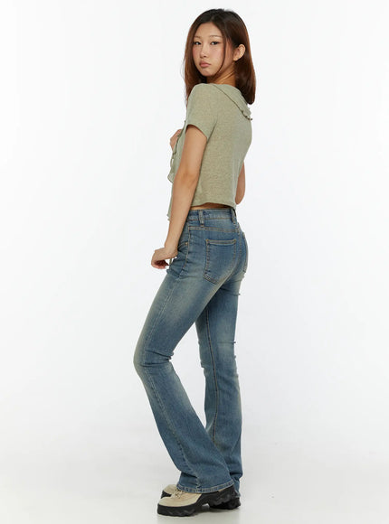 Kendall Vintage Bootcut Jeans CL515 Blue side back shot on model looking over shoulder showing bootcut flare and back pocket detail