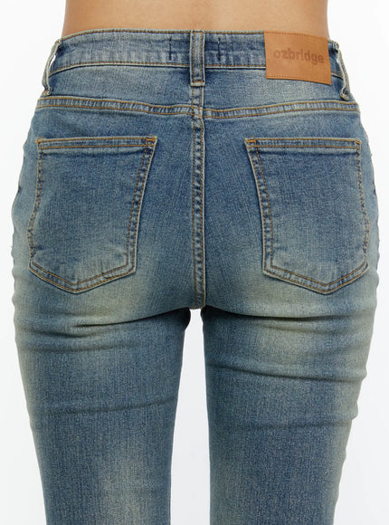 Kendall Vintage Bootcut Jeans CL515 Blue close-up back waist detail showing dual patch pockets ozbridge leather logo tag and worn fading