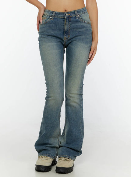 Kendall Vintage Bootcut Jeans CL515 Blue front view on model hand in pocket showing mid-rise waistband and bootcut flare leg full length