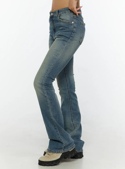 Kendall Vintage Bootcut Jeans CL515 Blue side view on model showing slim hip to flare leg silhouette with vintage wash denim texture
