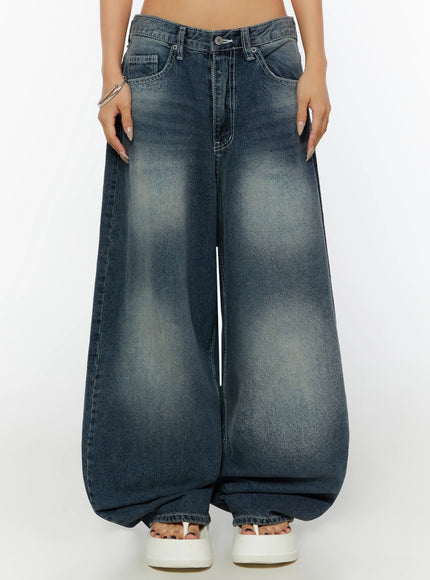 Kenji Baggy Wide-Leg Jeans IL524 Dark blue front shot on model cropped at waist, wearing blue cami top and silver bracelets, showing extreme wide balloon leg silhouette
