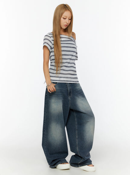 Kenji Baggy Wide-Leg Jeans IL524 Dark blue full-length side shot on model looking down, styled with striped asymmetric knit top and white platform sandals