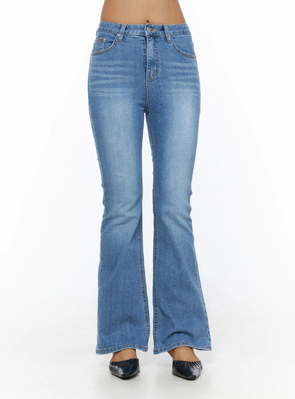 Kerry Washed Bootcut Jeans CL503 Blue front view on model standing showing full-length bootcut flare mid-rise waist washed denim with flat mule shoes
