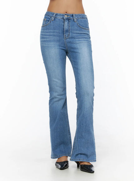Kerry Washed Bootcut Jeans CL503 Blue front view on model standing showing mid-rise waist button fly and flared bootcut leg washed denim