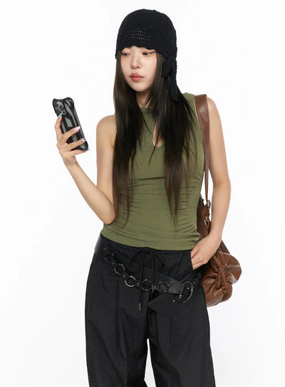 LEWKIN Keyhole Button Hooded Crop Sleeveless Top CL514 Dark green front model shot holding phone styled with black cargo pants and knit hat