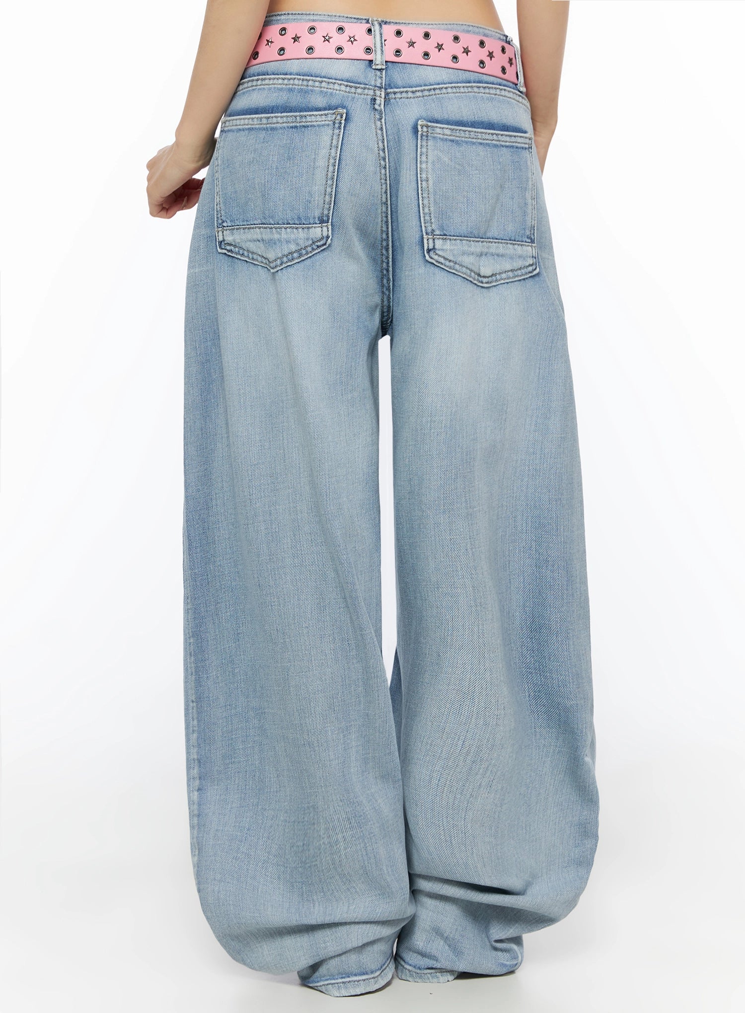 Kit Washed Wide Leg Jeans IL523 Light blue back view on model, close-up of dual back patch pockets and pink star-stud belt with grommet detail