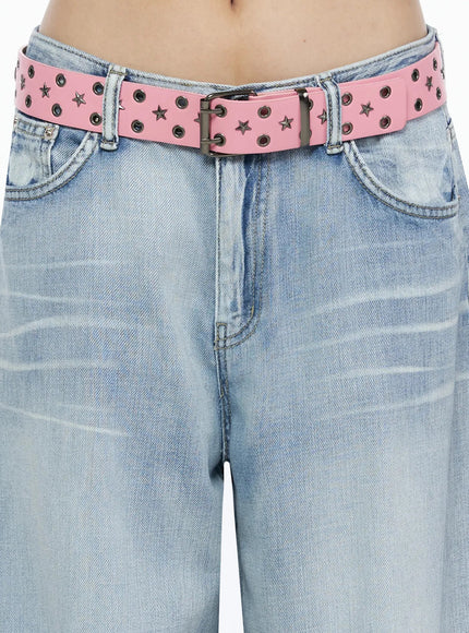 Kit Washed Wide Leg Jeans IL523 Light blue close-up detail of pink star and eyelet studded belt worn at low waist over light blue washed denim
