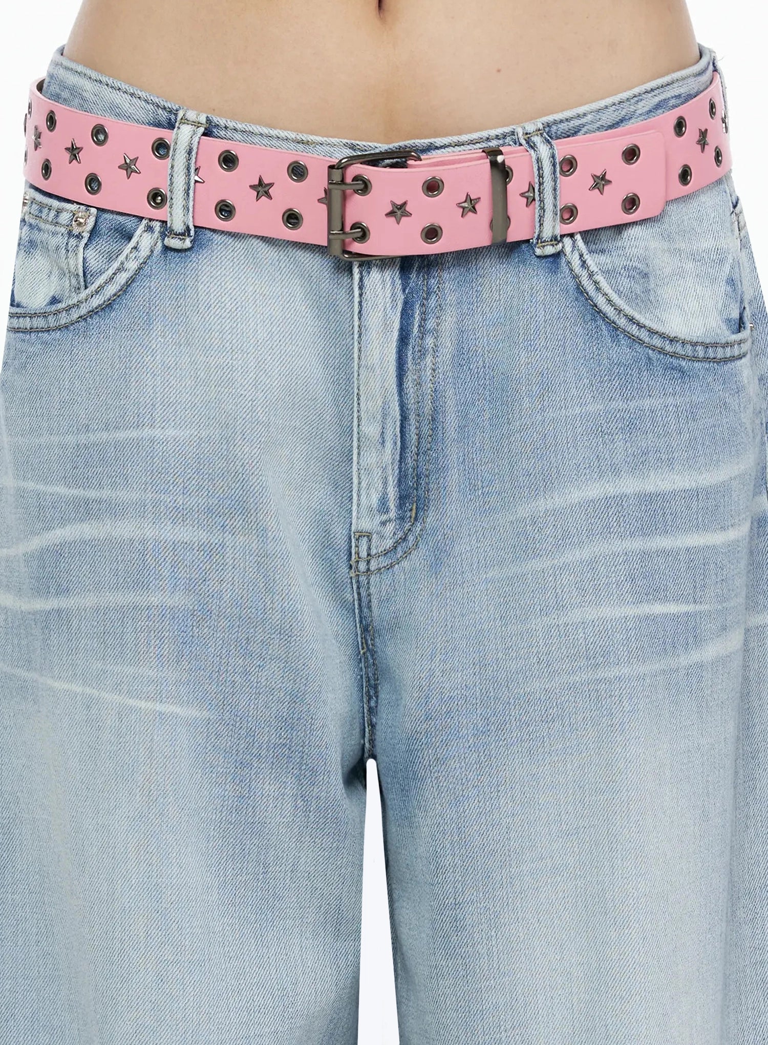 Kit Washed Wide Leg Jeans IL523 Light blue close-up detail of pink star and eyelet studded belt worn at low waist over light blue washed denim