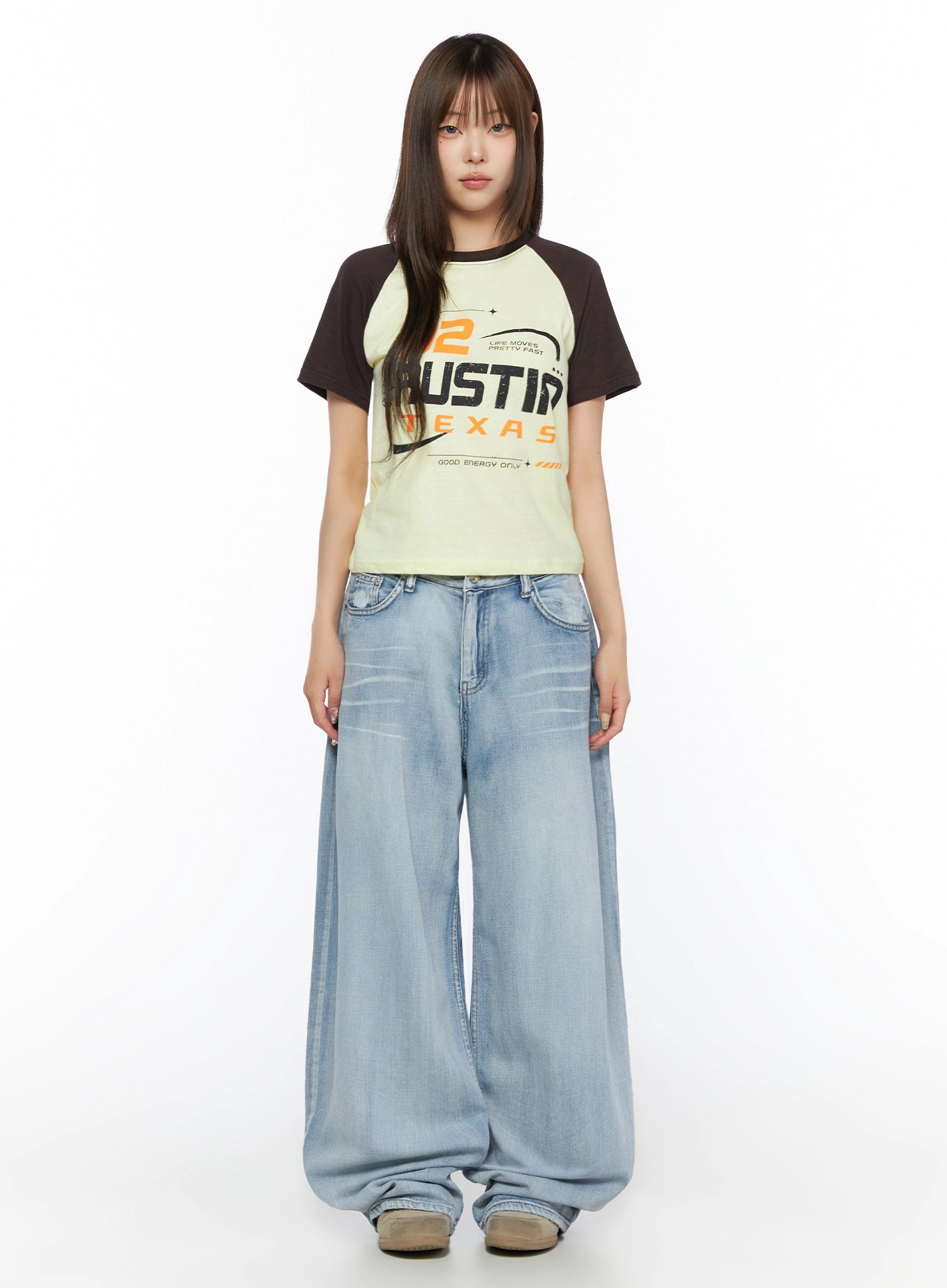 Kit Washed Wide Leg Jeans IL523 Light blue full front view on model with graphic raglan tee, straight standing pose, ultra-wide leg washed denim, no belt