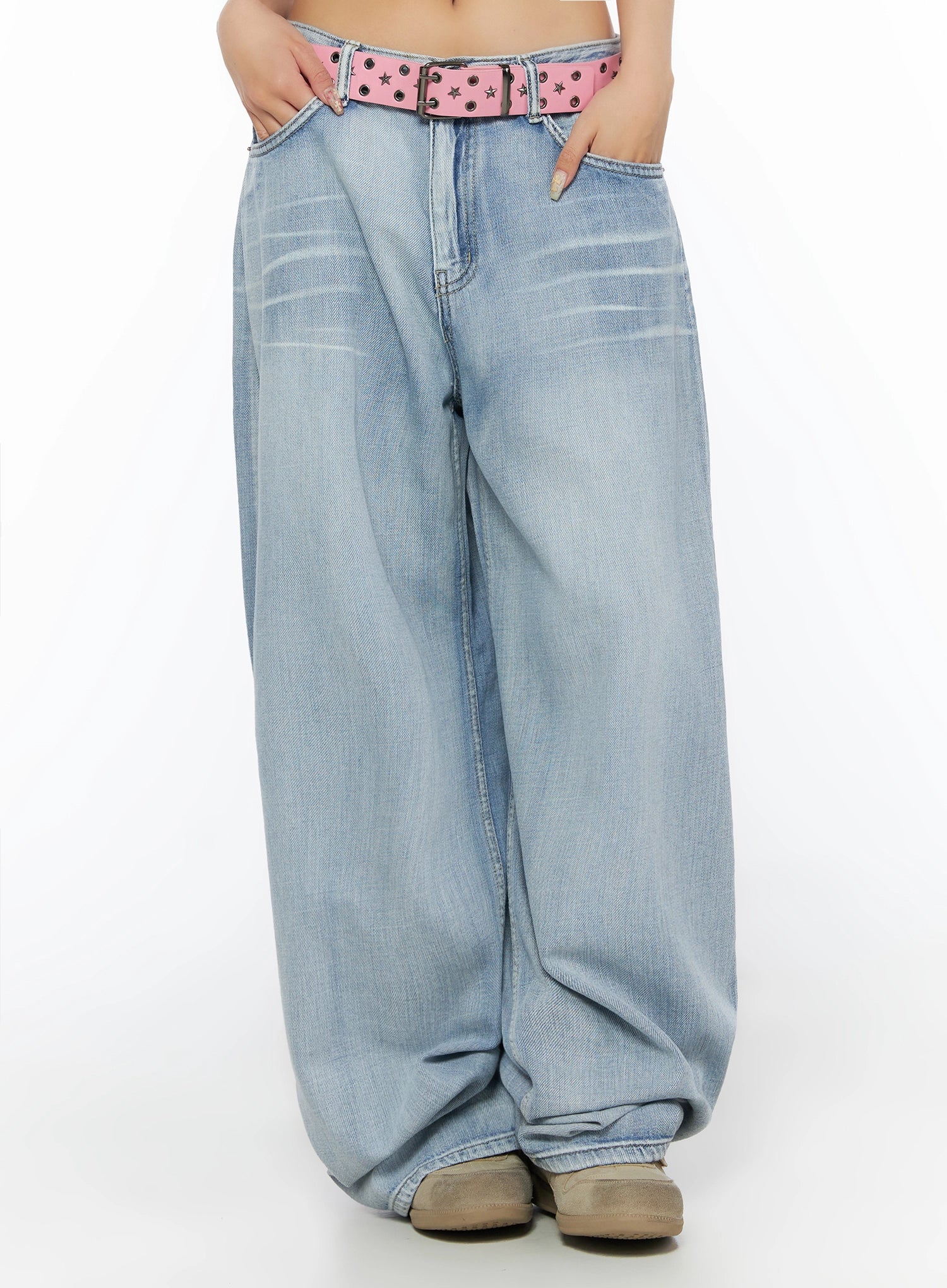 Kit Washed Wide Leg Jeans IL523 Light blue front cropped view on model, hands in pockets, pink star-stud belt at low waist, washed crease detail on thighs