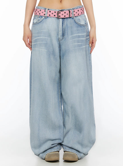 LEWKIN Kit Washed Wide Leg Jeans IL523 Light blue front view on model, low-rise washed denim with pink star-stud belt, wide balloon leg, cropped shot