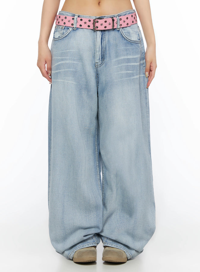 LEWKIN Kit Washed Wide Leg Jeans IL523 Light blue front view on model, low-rise washed denim with pink star-stud belt, wide balloon leg, cropped shot