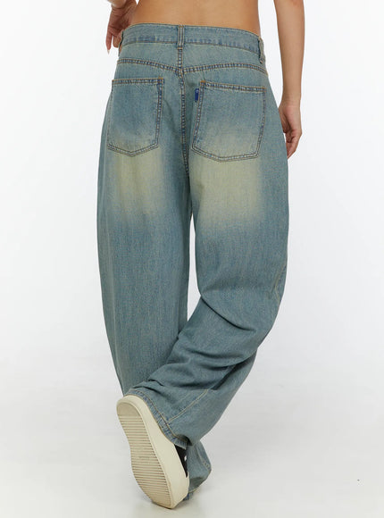Kiva Washed Wide-Leg Jeans CL515 Light blue back view on model showing dual patch pockets, blue brand tab, contrast stitching, and vintage yellow fade wash