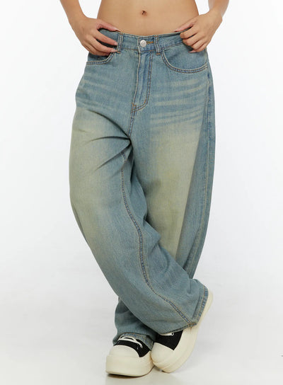 Kiva Washed Wide-Leg Jeans CL515 Light blue front close-up on model with hands tucked in waistband, showing low-rise fit, wide balloon leg, and washed denim texture