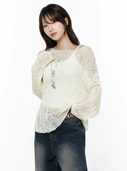 Knit Boat Neck Sweater IL506 Light beige angled front shot on model with arms relaxed, sheer open-knit, star necklace, leopard print belt peek, wide-leg denim, S/M