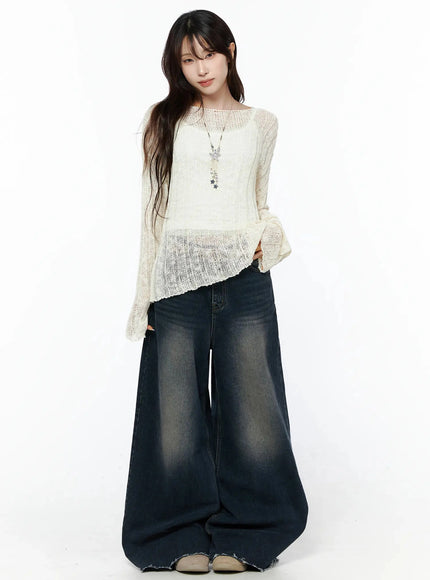 Knit Boat Neck Sweater IL506 Light beige full-body front shot on model standing upright, sheer knit with asymmetric hem, star necklace, wide-leg faded jeans, S/M