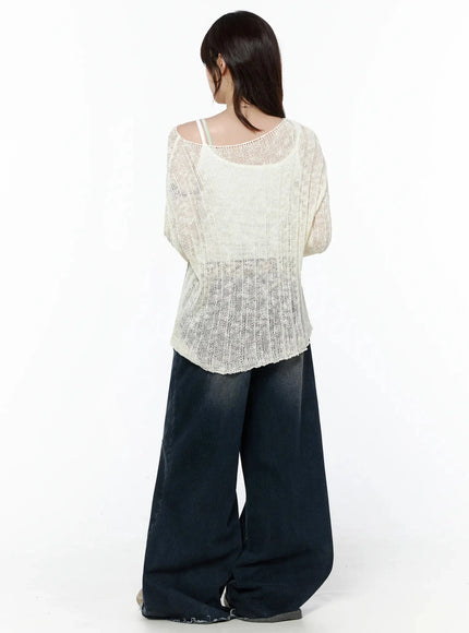 Knit Boat Neck Sweater IL506 Light beige back shot on model showing rear knit texture, semi-sheer open weave, white cami strap visible at neckline, wide-leg denim, S/M
