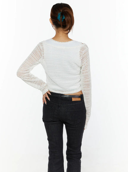 Knit Crop Cardigan CL515 White back shot on model showing open-knit texture sheer raglan sleeves and cropped hem with scallop trim