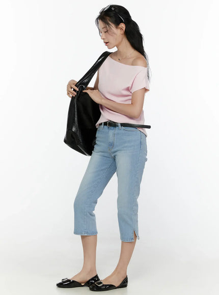 Knit Off-Shoulder Top CL521 Pink side shot on model holding black tote bag, full-length styling with blue cropped jeans and black flats