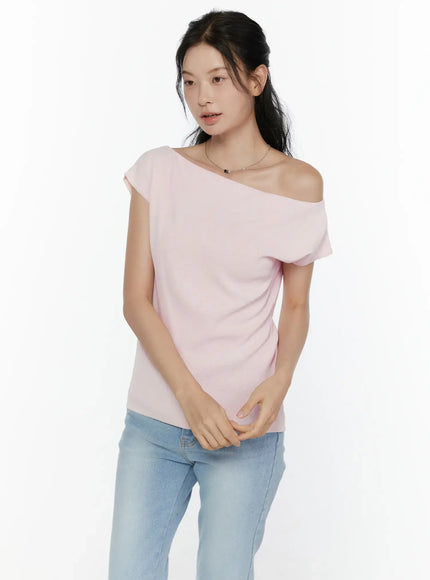 Knit Off-Shoulder Top CL521 Pink close-up front shot on model showing wide off-shoulder neckline, fitted knit fabric texture, paired with blue jeans