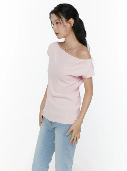 Knit Off-Shoulder Top CL521 Pink side profile shot on model showing fitted silhouette, asymmetric shoulder neckline detail and knit texture