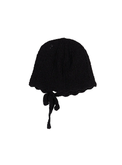 Knit Ribbon Beanie CL517 Black flat product shot on white background, dome-shaped open-knit crochet beanie with scalloped brim and dangling ribbon tie