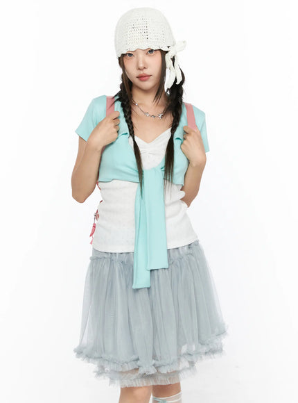 Knit Ribbon Beanie CL517 White full-body front on model styled with mint cardigan, tulle skirt, braided pigtails, and pink plaid backpack