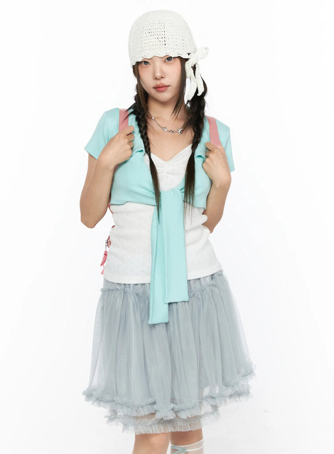 Knit Ribbon Beanie CL517 White full-body front on model styled with mint cardigan, tulle skirt, braided pigtails, and pink plaid backpack