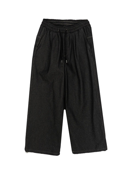 Kris Back Graphic Baggy Jeans IL524 Black flat-lay front view showing elastic drawstring waistband wide-leg cut contrast topstitching and full-length denim silhouette