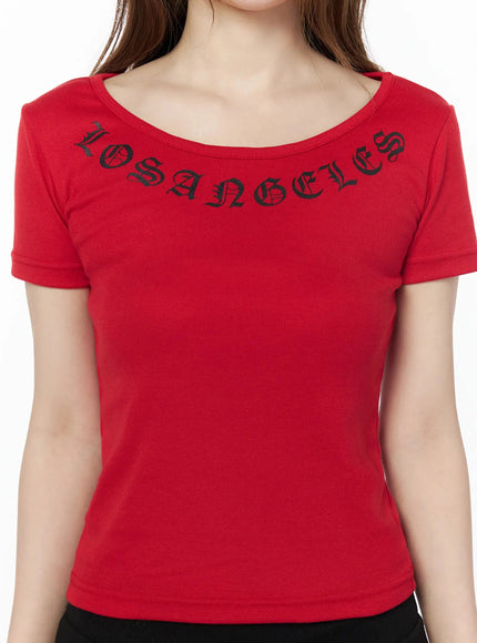 LA Graphic Round Neck Crop Top IL502 Red close-up front detail, black old English LOS ANGELES lettering along wide scoop neckline on ribbed fabric