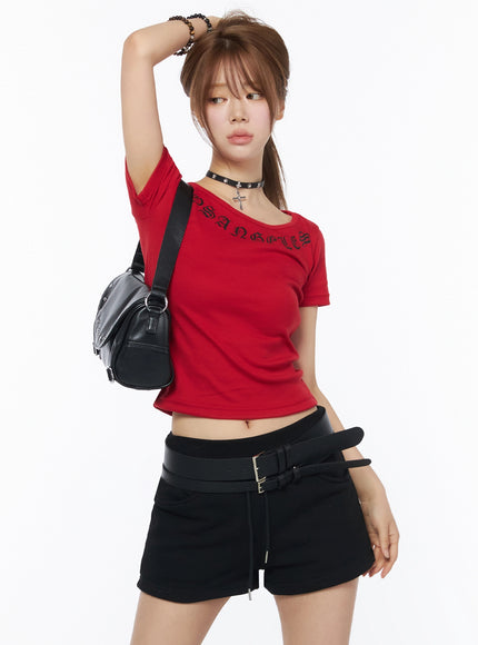 LEWKIN LA Graphic Round Neck Crop Top IL502 Red model front three-quarter shot with arm raised, styled with black crossbody bag and choker