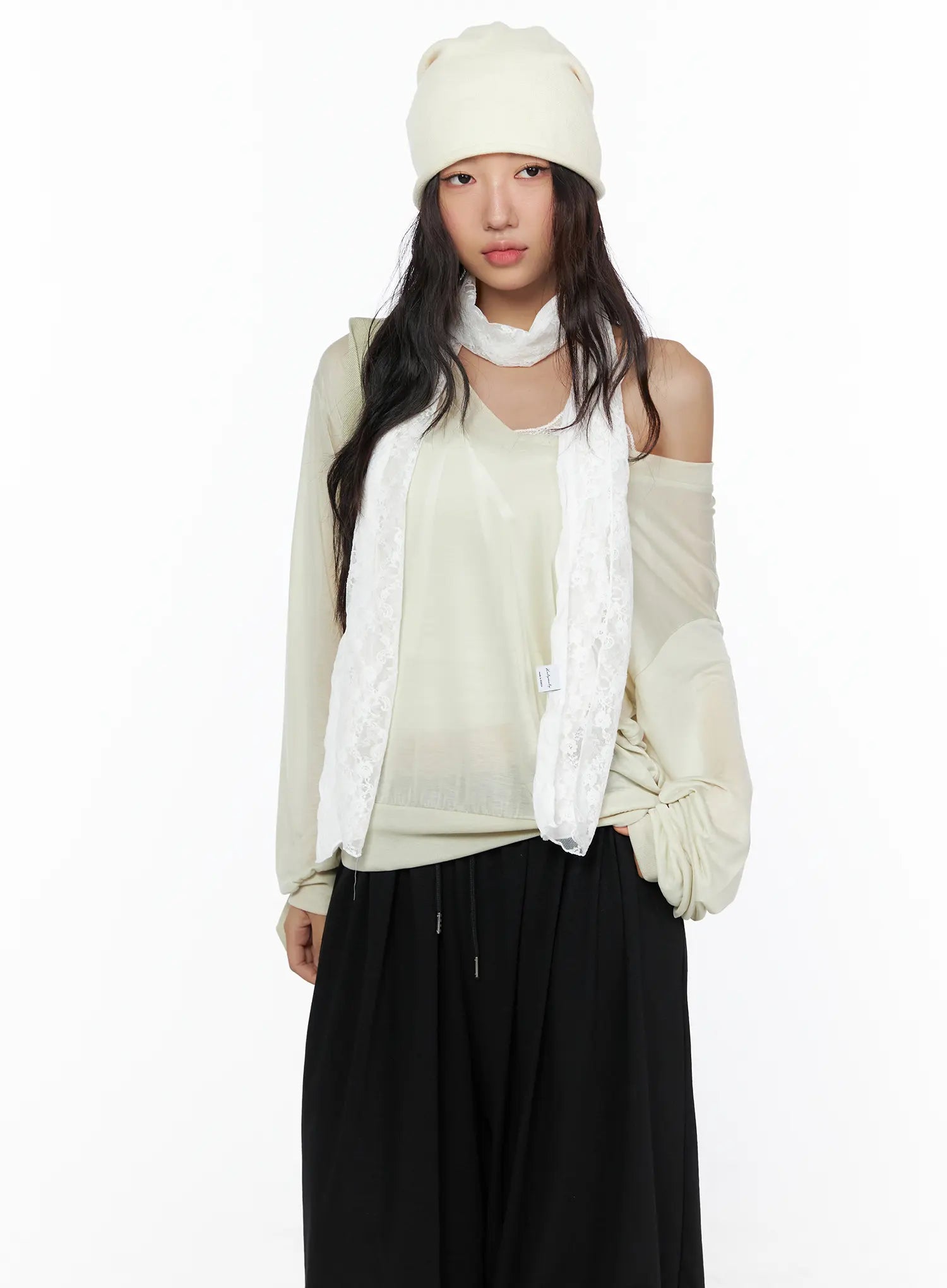 Lace Accent Sheer Scarf CL513 White front shot on model wearing cream beanie with scarf draped loosely over beige sheer off-shoulder top and black wide-leg pants