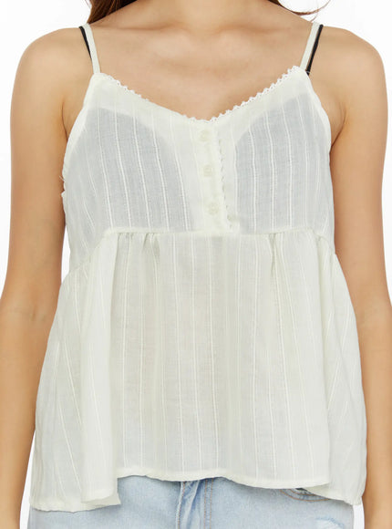 Lace Babydoll Top CL515 Light beige close-up front detail on model, lace trim V-neckline, pearl buttons, semi-sheer woven stripe texture visible