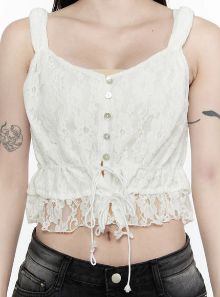 Lace Button-Up Cami Blouse IL522 White close-up front detail shot on model showing floral lace texture pearl buttons and adjustable drawstring ruffle hem