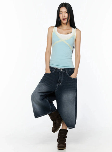 Lace Contrast Cami Top IL509 Light blue full-length front shot on model one leg raised styled with wide-leg denim and platform sneakers