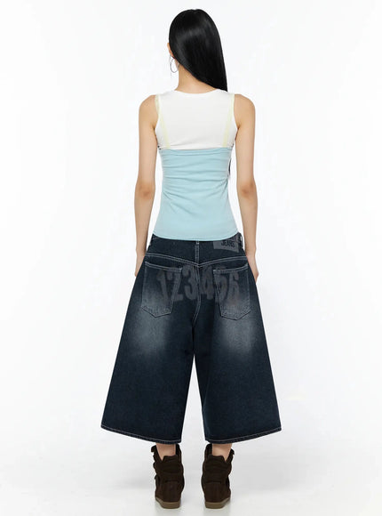 Lace Contrast Cami Top IL509 Light blue back shot on model showing white upper back panel and light blue lower with cream lace trim detail wide-leg jeans