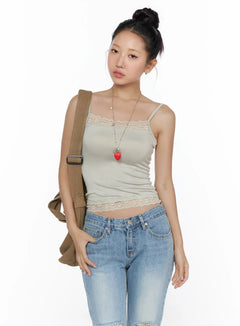 LEWKIN Lace Detail Cami Top CL513 Beige front view on model with bun updo styled with crossbody bag and blue jeans, lace neckline and hem trim