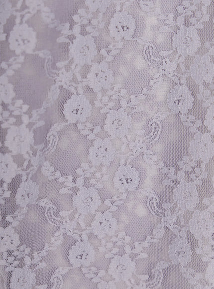 Lace Detail Capri Leggings CL508 White close-up detail shot of semi-sheer lavender-toned floral lace fabric texture showing intricate flower and paisley pattern