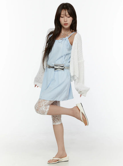 Lace Detail Capri Leggings CL508 White full-body styling shot on model one leg raised styled with light blue mini dress white knit cardigan and silver belt bag