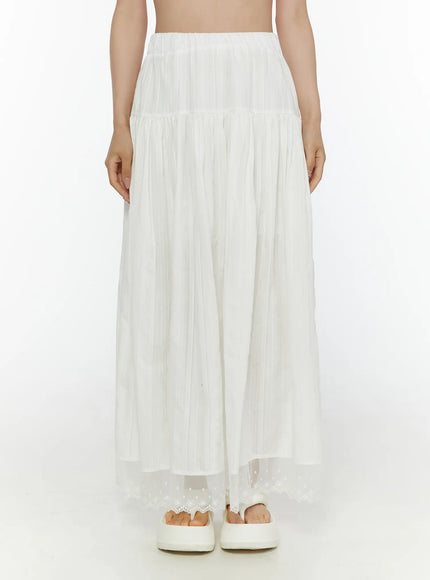 Lace Flared Maxi Skirt CL507 white front shot on model standing centered showing full-length tiered pleated skirt with embroidered lace hem