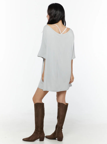Lace Frill Shorts CU529 White back full-body shot on model with grey oversized tee showing back neckline detail brown cowboy boots standing pose
